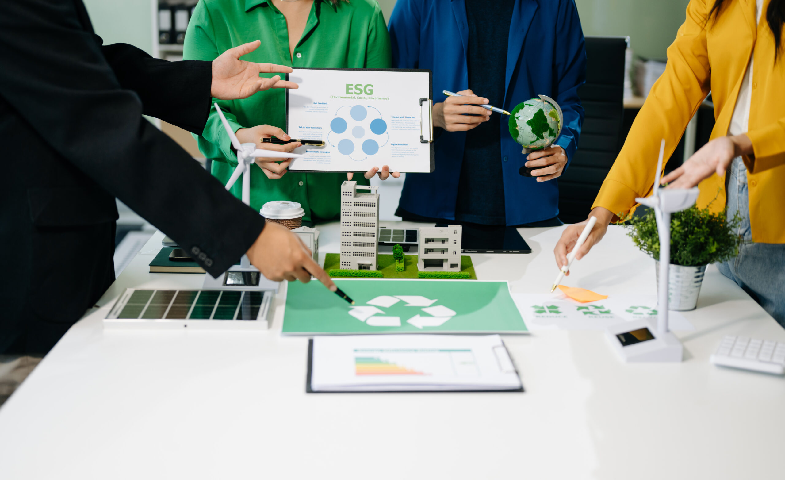 Business team working virtual modern smartphone to reduce CO2 emissions carbon footprint climate change to limit global warming.Sustainable development and green business concept. at office